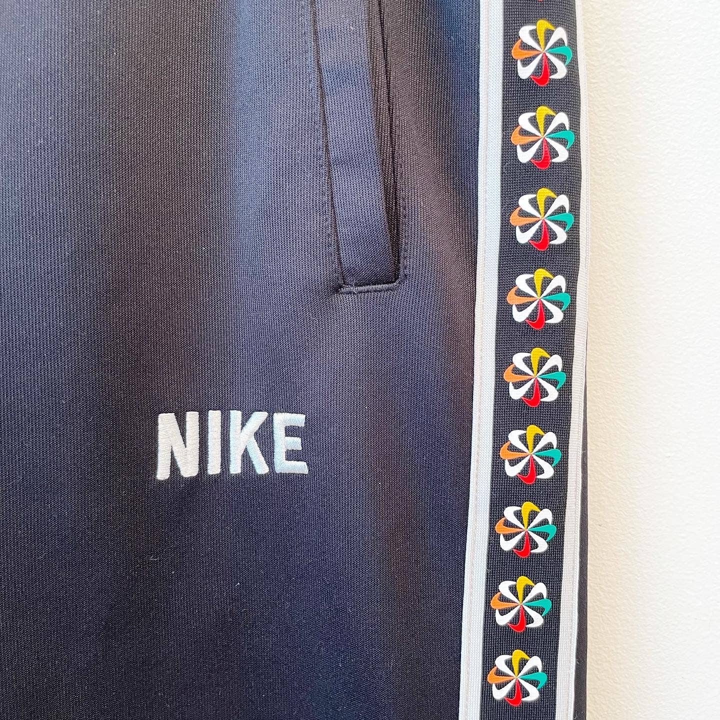 Nike Mens S Evolution of the Swoosh Jogger Track Pants Tribute Pinwheel Logo